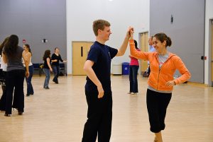 Karoline Kasiorowski, a senior Molecular and Cell Biology and Anthropology major, dances with Scott Loescher, a senior Biology major during the UConn Ballroom Club's meeting at the Rome Ballroom.