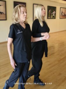 Professional dance coach demonstrating arm styling and hand articulation in Glencoe, IL.